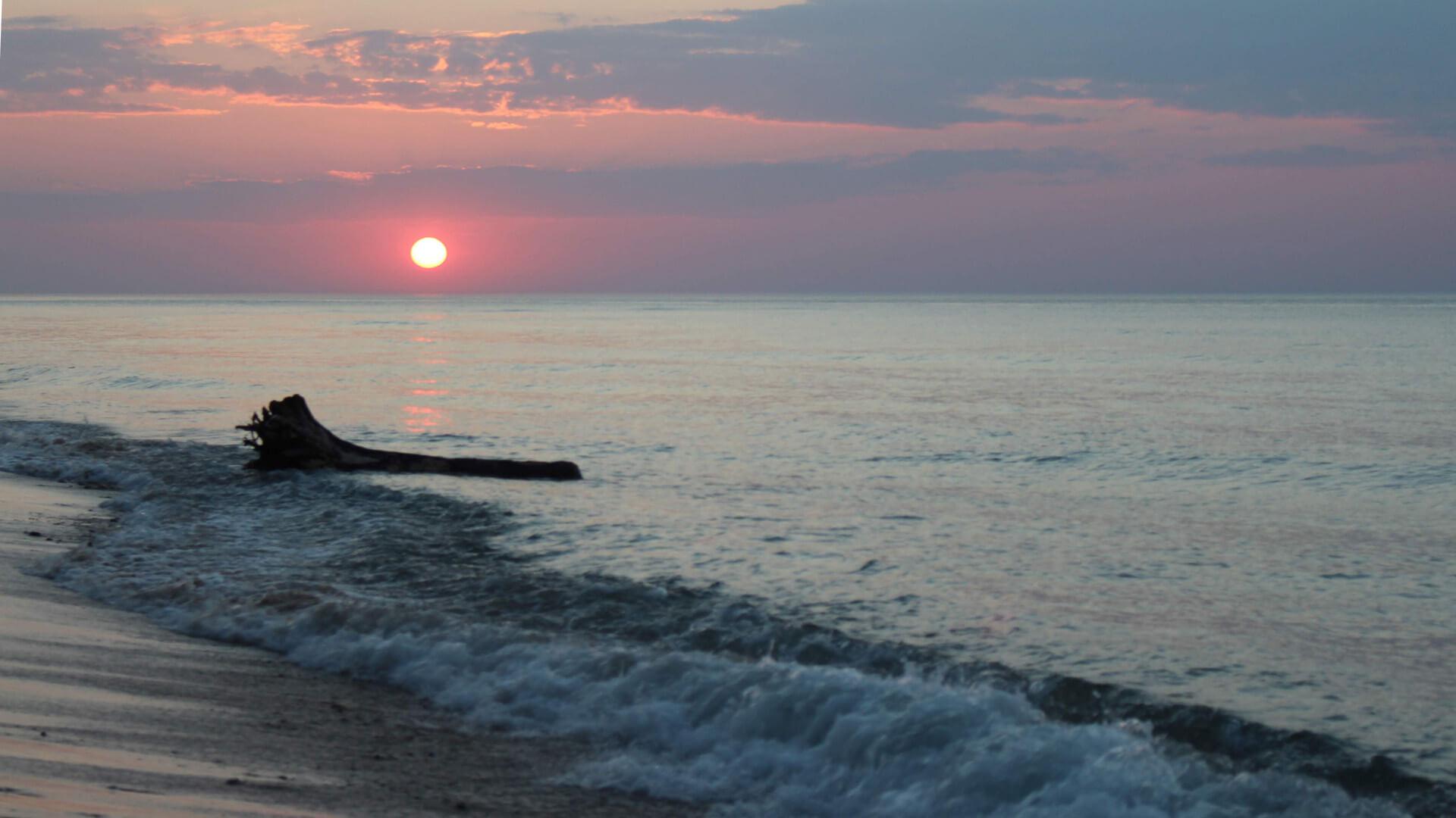 a rosy sunset over Lake Superior near Muskallonge State Park