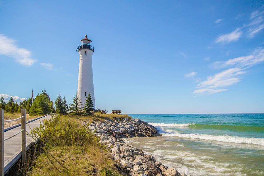 An exterior shot of Crisp Point Lighthouse on a sunny day.