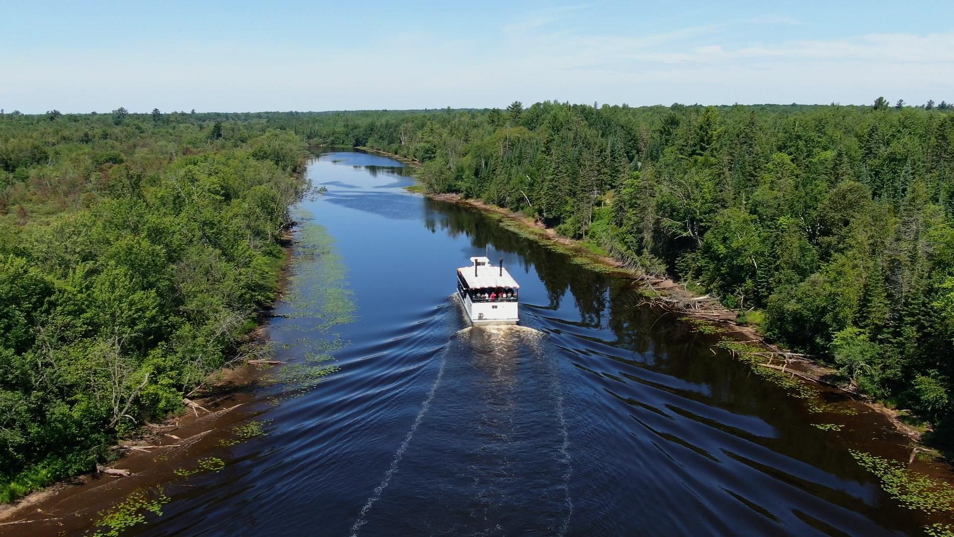 The Tahquamenon Falls Riverboat heading up the river.