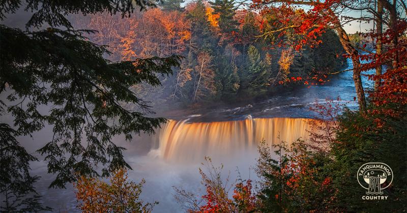 Upper Tahquamenon Falls surrounded by fall colors.