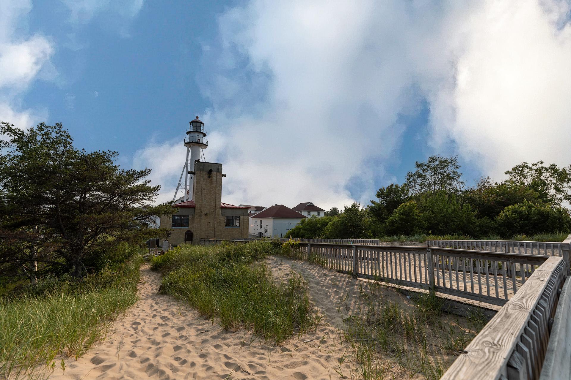 A boardwalk leading to the Whitefish Point Lighthouse