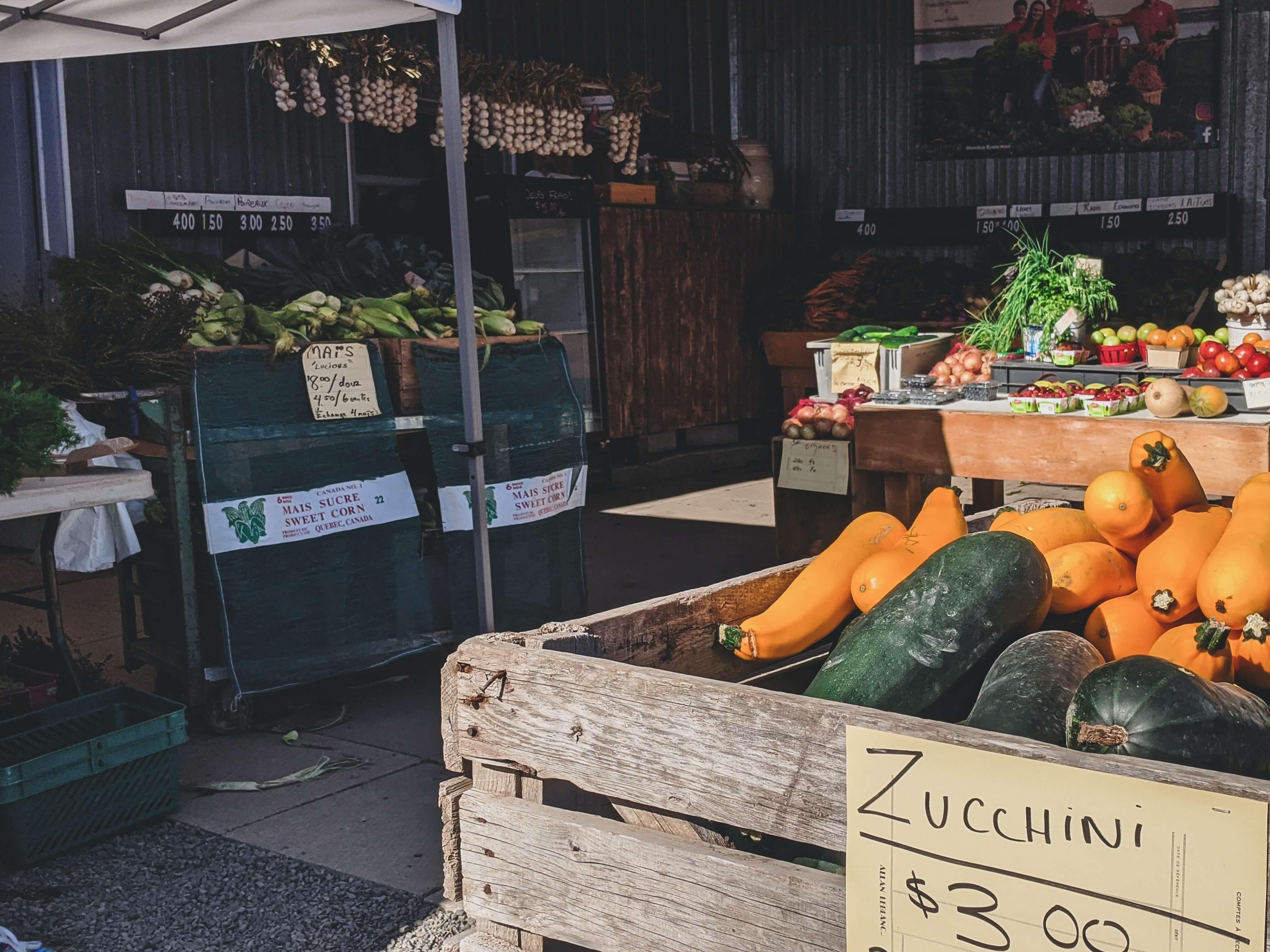 fresh produce at an outside farmers market booth
