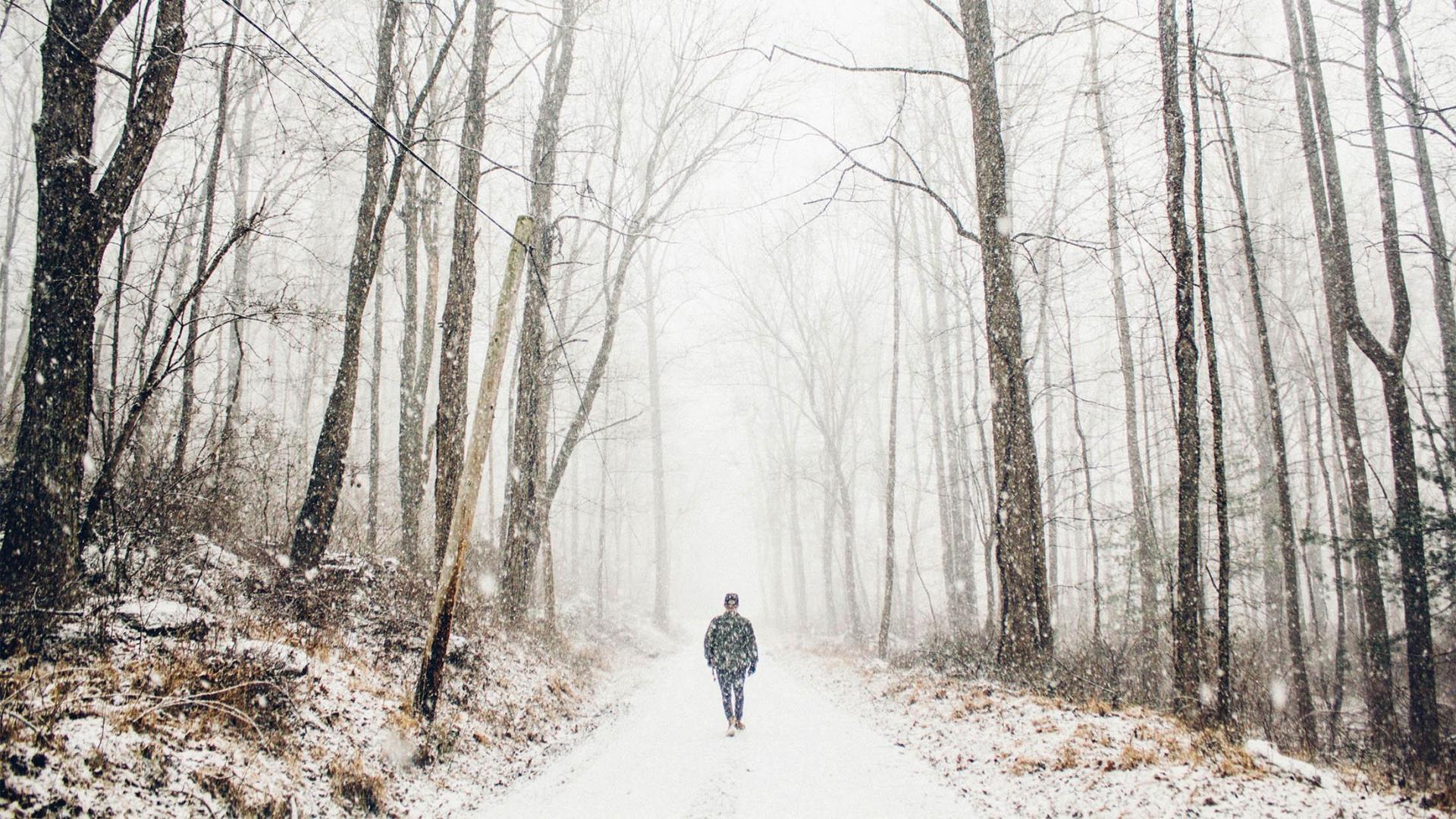 A person on a walk in the winter.